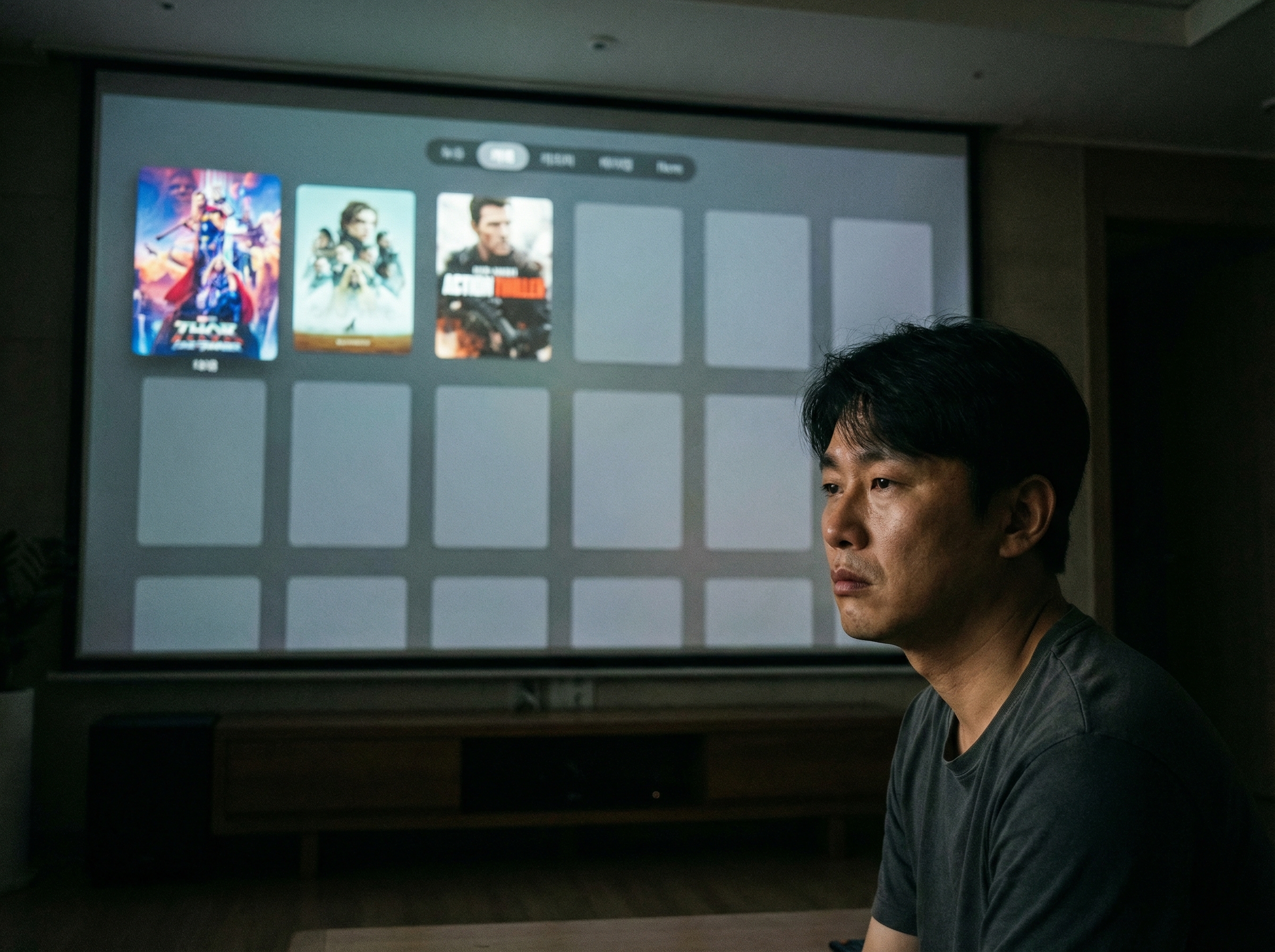 A person (Korean appearance) looking at a sparse selection of streaming content on a large screen, with only a few blockbuster titles visible and many empty spaces. A feeling of limited choices. Darker, thoughtful tone. Aspect ratio 4:3, no visible text.