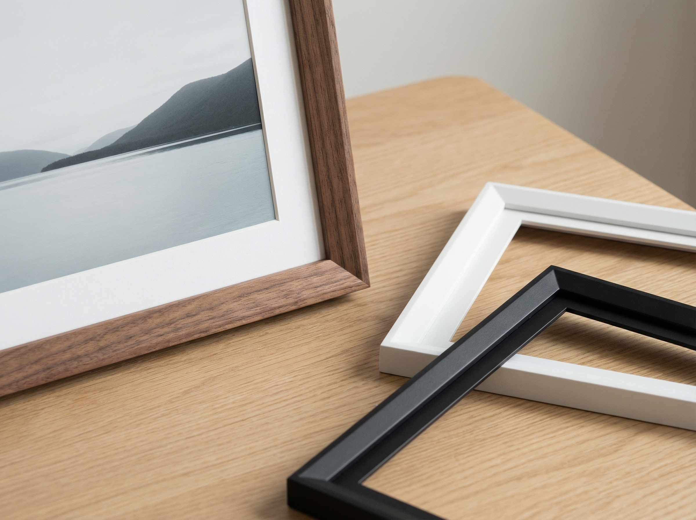 Close up of a digital frame with interchangeable bezels in different colors like wood, white, and black. Minimalist aesthetic, clean presentation, soft shadows, aspect ratio 4:3, no visible text.