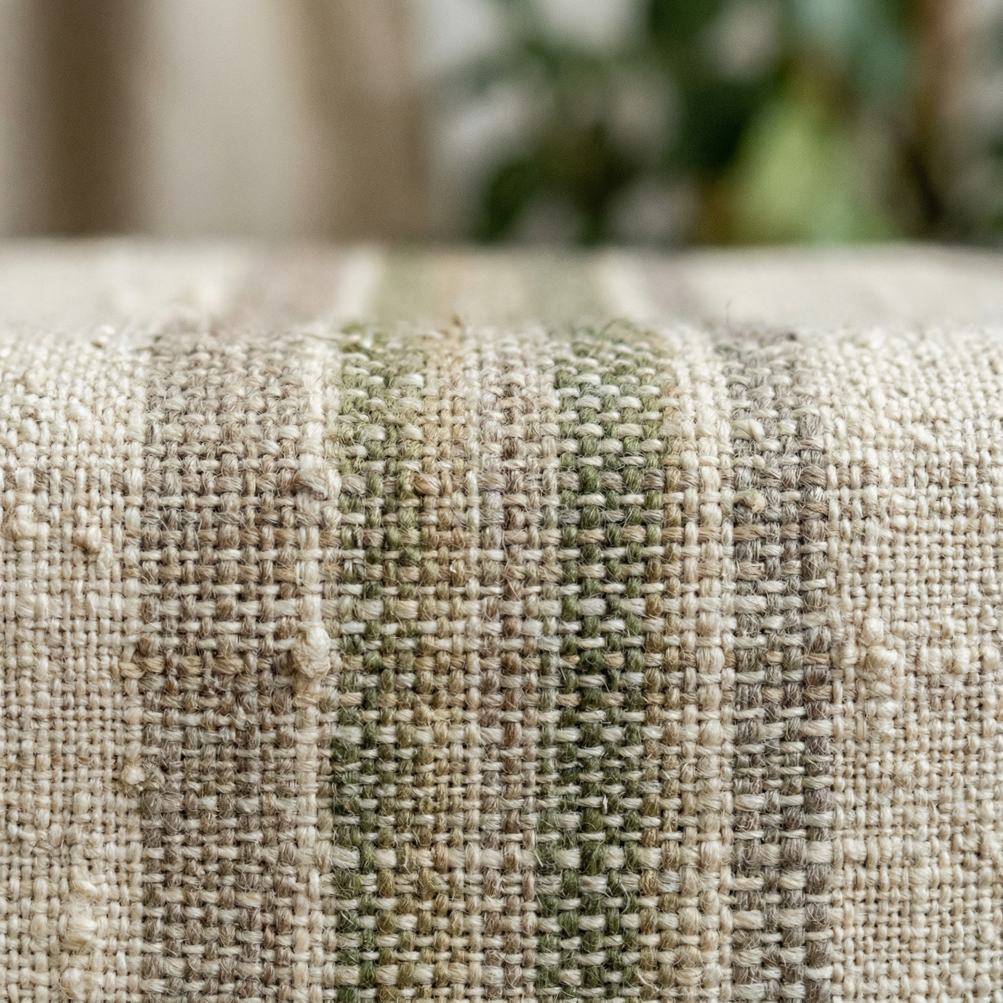 Close up shot of eco-friendly textile made from recycled materials, organic texture, earthy tones, minimalist design, soft focus background, high quality, 1:1 aspect ratio, no text
