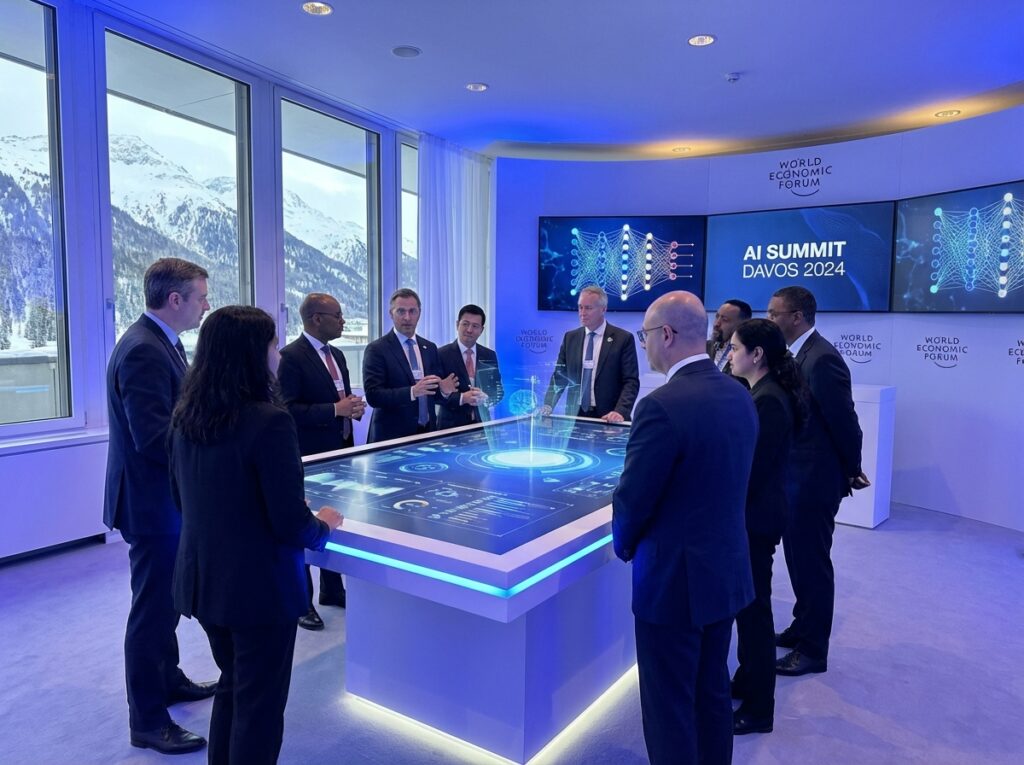 A high tech conference room inside the World Economic Forum in Davos with a diverse group of business leaders discussing AI technology blue and white ambient lighting professional atmosphere 4:3