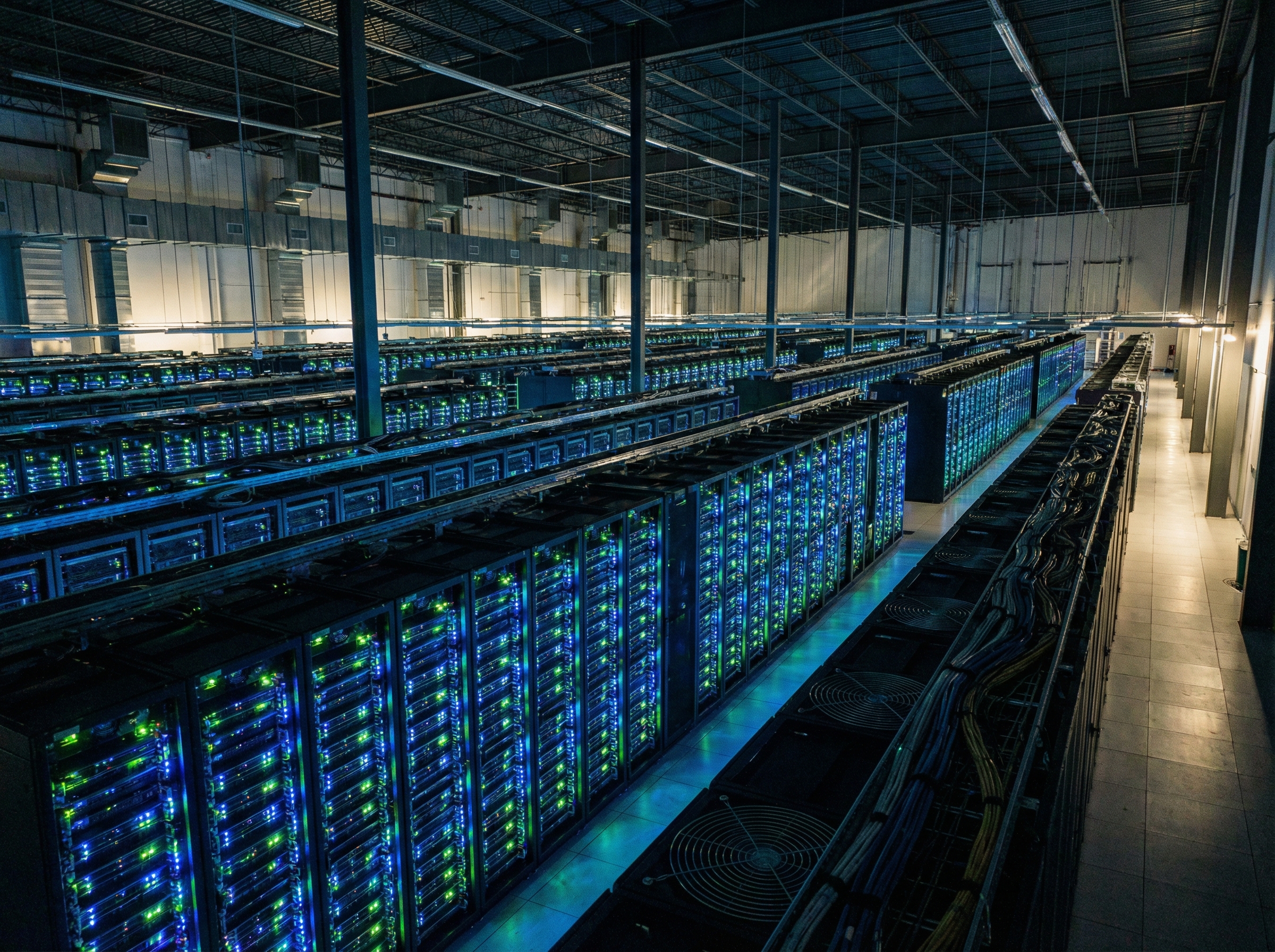 A vast, modern data center with rows of server racks, glowing green and blue LED lights, cooling fans visible, cinematic lighting, wide angle, 4:3 aspect ratio, no text.